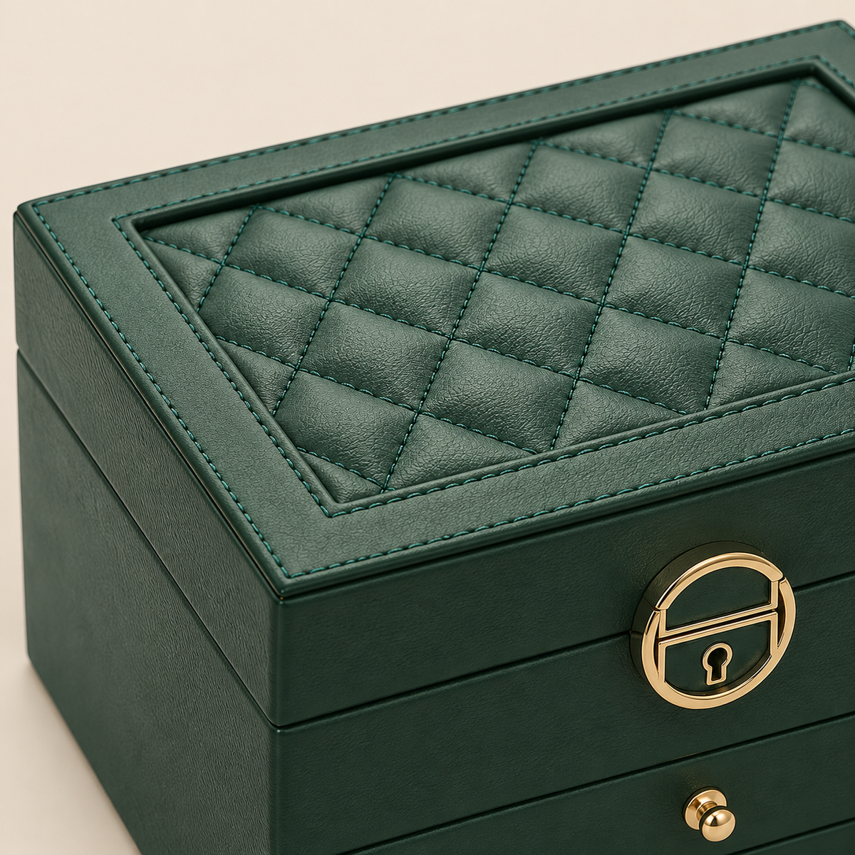 green macro of large green jewelry organizer with drawers lock on beige; styling accessories not included