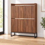 Fluted walnut-look shoe cabinet in a styled entryway; decor not included