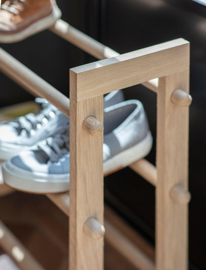 Low hallway shoe rack with raw oak shelves