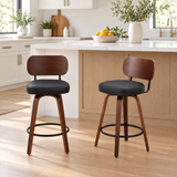 Two walnut and black swivel counter stools in a styled kitchen; room decor not included