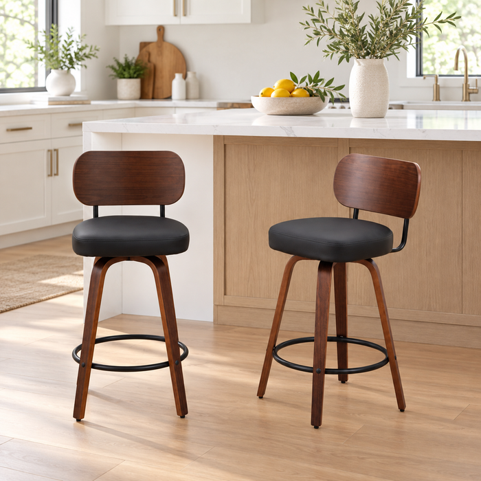 Two walnut and black swivel counter stools in a styled kitchen; room decor not included